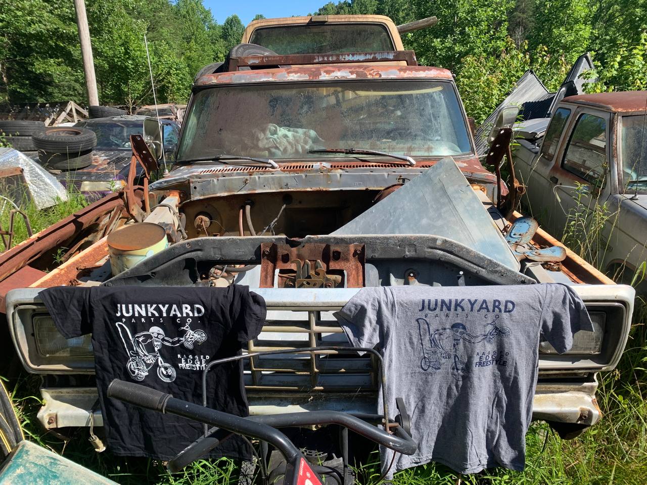 Junkyard shirts on a junked truck